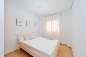 Katil atau katil-katil dalam bilik di Ca Martina I Apartamento ideal con gran terraza cerca del mar +17 gambar