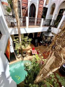 an overhead view of a swimming pool in a building at Riad La Porte Rouge in Marrakesh