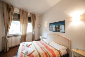 Posteľ alebo postele v izbe v ubytovaní Nice Apartment Near Ponte Vecchio