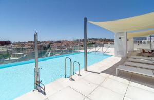 a swimming pool with a view of a city at INF25E- Tastefully furnished flat, Estepona center in Estepona