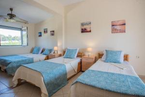 Ένα ή περισσότερα κρεβάτια σε δωμάτιο στο Diogenis villa