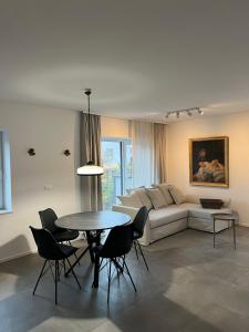 a living room with a couch and a table at Apartments Lily in Ljubljana