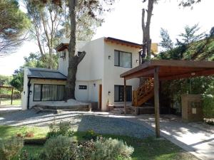 a house with a tree in front of it at Moradas del Bosque in Costa del Este