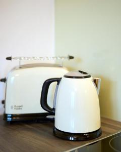 a white toaster sitting on top of a counter at Stilvolles Apartment in zentraler Lage in Graz