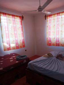 Postel nebo postele na pokoji v ubytování New Iddi Villa