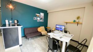 a living room with a table and a couch at Amanecer del Fuego III in Ushuaia