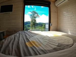 Postel nebo postele na pokoji v ubytování Tiny House Birner Ertl
