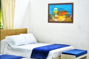 Postel nebo postele na pokoji v ubytování Casa Flórez Hotel Campestre
