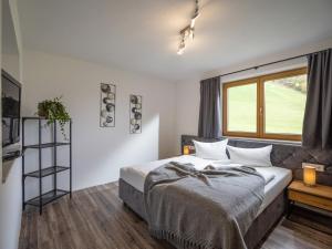 Postel nebo postele na pokoji v ubytování Zillertal Suites