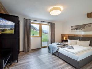 Postel nebo postele na pokoji v ubytování Zillertal Suites