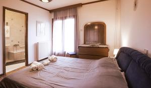 Ένα ή περισσότερα κρεβάτια σε δωμάτιο στο Georgia's GuestHouse