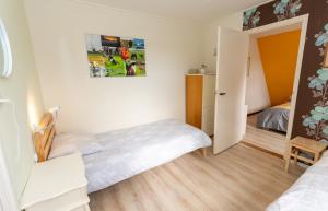 Postel nebo postele na pokoji v ubytování Vakantiehuis met fraai uitzicht