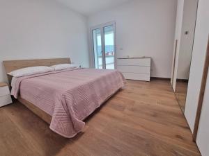 Кровать или кровати в номере SUITE GENTILE