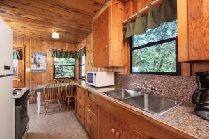 a kitchen with a sink and a counter top at Idyllwild Inn and Strawberry Creek Inn in Idyllwild