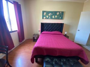 A bed or beds in a room at Intimo Hotel Los Heroes
