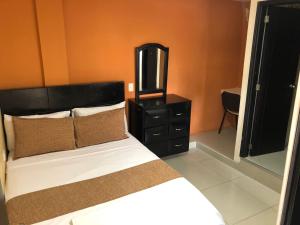 Hotel Ecosuite Quibdó客房内的一张或多张床位