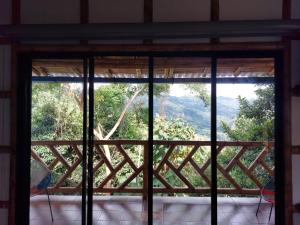 Fotografie z fotogalerie ubytování Las cabañas del escobo-CABAÑA GUACAMAYAS v destinaci Nimaima