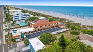 an aerial view of a beach and a building at Anthony's on the Beach in Cocoa Beach