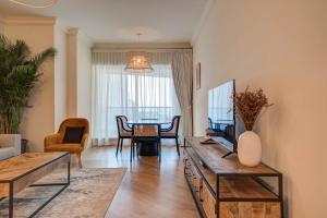 a living room with a couch and a table at Stunning 2BR l Marina View in Dubai