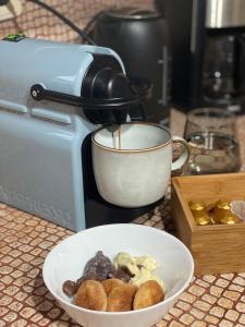 a mixer next to a bowl of food on a counter at Urban River House in Florina