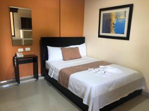 Hotel Ecosuite Quibdó客房内的一张或多张床位