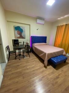 A bed or beds in a room at Intimo Hotel Los Heroes