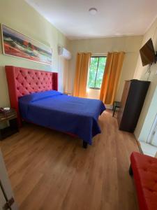 A bed or beds in a room at Intimo Hotel Los Heroes