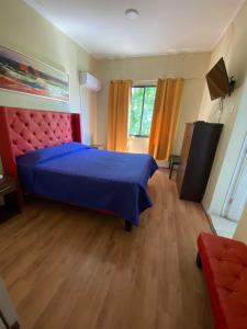 A bed or beds in a room at Intimo Hotel Los Heroes
