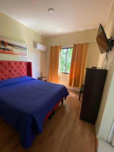 A bed or beds in a room at Intimo Hotel Los Heroes