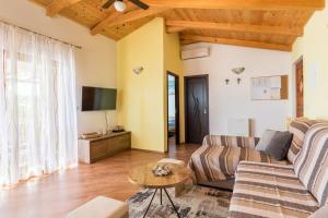 a living room with a couch and a table at beautiful bay house Duga in Okrug Gornji