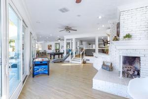 a living room with a white brick fireplace at Bay Shore in Panama City Beach