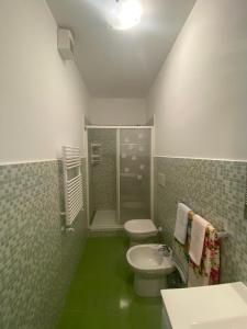 a bathroom with a sink and a toilet and a shower at IL QUADRIFOGLIO in Castellammare di Stabia