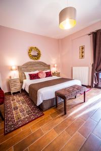 a bedroom with a large bed and a rug at MARON in Kalavrita