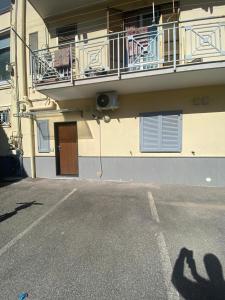 a shadow of a person standing in front of a building at IL QUADRIFOGLIO in Castellammare di Stabia