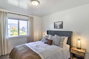 a bedroom with a large bed with a window at Kalispell Home with 2 Suites about 35 Mi to Glacier in Kalispell