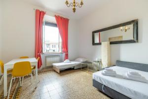 Postel nebo postele na pokoji v ubytování [San Pietro view point] Appartamento elegante