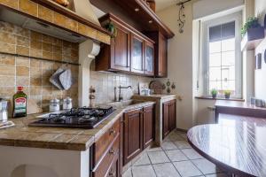 Kuchyň nebo kuchyňský kout v ubytování [San Pietro view point] Appartamento elegante