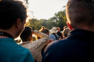 a group of people standing in a crowd at Jamu Lodge in the Cuyabeno Wildlife Reserve in Cuyavenus