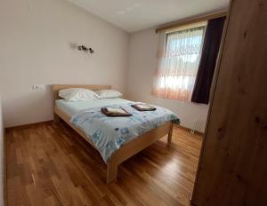 Postel nebo postele na pokoji v ubytování Vila Mana
