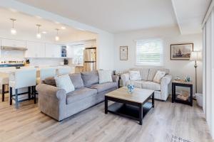 a living room with a couch and a table at 14 Clipper on the Bay in Ocean Pines