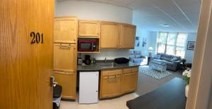 a kitchen with a sink and a microwave at Pershing Heights 201 in New Kensington