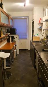 a kitchen with a sink and a window in it at Apartment im Zentrum in Frankfurt