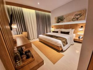 A bed or beds in a room at Truntum Boutique Mandalika