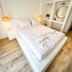 מיטה או מיטות בחדר ב-Aloha Suites