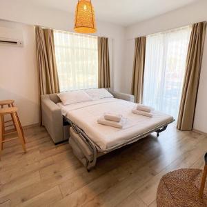 Postel nebo postele na pokoji v ubytování Aloha Suites