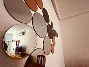 a mirror hanging on a wall in a room at VAO Holiday Rentals-Santiago De la Ribera in San Javier