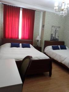 Cama o camas de una habitación en Residencial Kontiki Miraflores