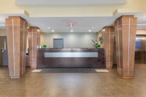 a lobby with a reception desk in a building at BEST WESTERN PLUS Saint John Hotel & Suites in Saint John