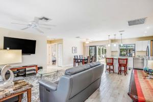 a living room with a couch and a table at Menorca Court in Marco Island