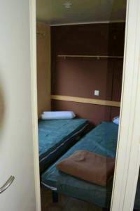a small room with two beds and a mirror at PARADIS-ZEN in La Roque-dʼAnthéron +36 photos